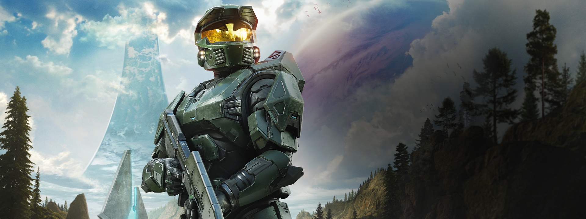 Master Chief in green armor holds a weapon while standing in a futuristic landscape with a large structure and a distant planet visible in the sky.